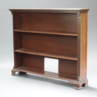 A 19th Century mahogany bookcase with moulded and dentil cornice, interior fitted adjustable shelves raised on ogee bracket feet 121cm h x 147cm w x 26cm d 