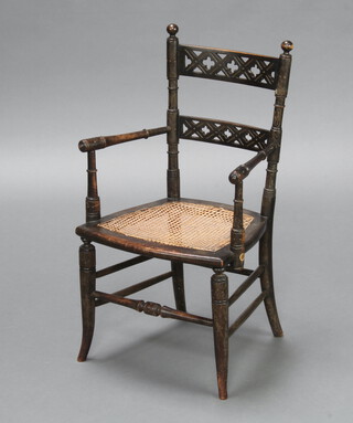 A child's 19th Century turned beech open arm carver chair with pierced ladder back and woven cane seat 66cm h x 35cm w x 32cm d (seat 20cm x 20cm) 