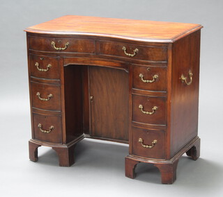 A 19th Century shaped mahogany dressing table fitted 2 drawers above cupboard with secret drawer enclosed by a panelled door flanked by 6 drawers 80cm h x 90cm w  51cm d  