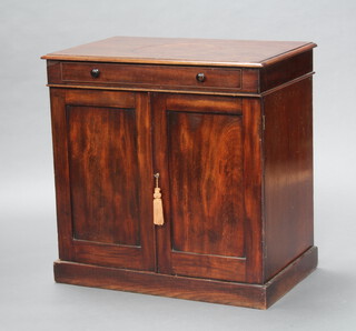 A Victorian mahogany washstand fitted a drawer above double cupboard enclosed by panelled doors, raised on a platform base 76cm h x 76cm w x 48cm d 