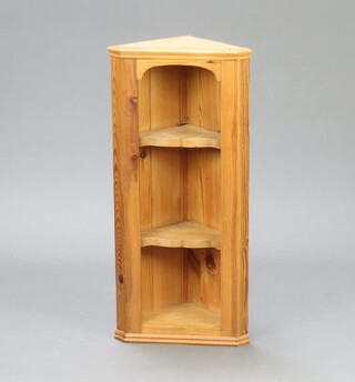 A pine open hanging corner cabinet with moulded cornice 69cm h x 32cm w x 22cm d 