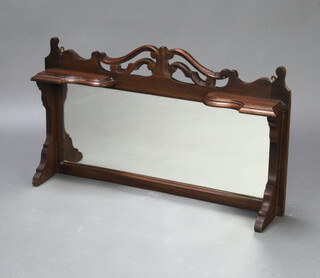 An Edwardian mahogany over mantel mirror with carved decoration 50cm x 85cm x 11cm 