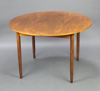 A teak oval extending dining table with concealed extra leaf, raised on turned supports 72cm h x 112cm diam. (when not extended)  