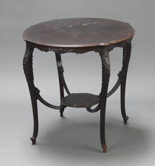 An Edwardian circular ebonised 2 tier occasional table raised on cabriole supports 71cm h x 72cm diam. (split to top)