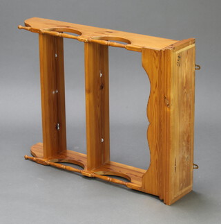 A Victorian style pine hanging 2 tier shelf with turned columns to the sides 82cm h x 75cm x 18cm d 