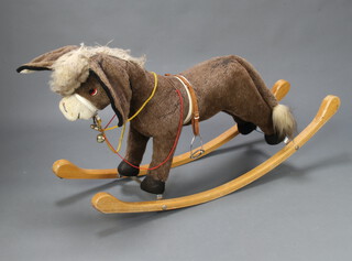A Merrythought for Harrods rocking donkey 70cm h x 158cm l x 38cm w (wear in places)