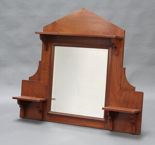An Edwardian rectangular bevelled plate over mantel mirror contained in a pyramid shaped mahogany frame with 2 shelves to the side 105cm x 122cm x 19cm 