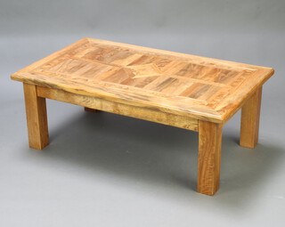 A hardwood marquetry rectangular coffee table raised on square supports 45cm h x 123cm w x 73cm d 