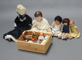 Two dolls with fabric bodies, 2 other dolls, a fabric doll and a Kiddicraft wooden pull along cart etc 
