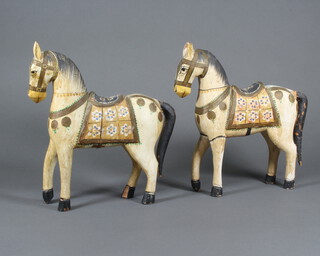 A pair of painted Continental figures of horses 32cm h x 30cm x 5cm 