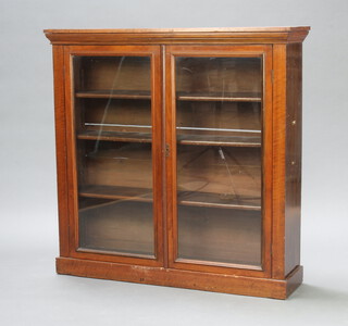 An Edwardian walnut bookcase/display cabinet fitted shelves enclosed by glazed panelled doors 106cm h x 107cm w x 28cm d  