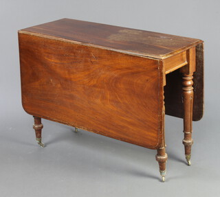 A William IV mahogany drop flap dining table on turned and fluted supports 71cm h x 98cm w x 40cm d (top has water marks) 