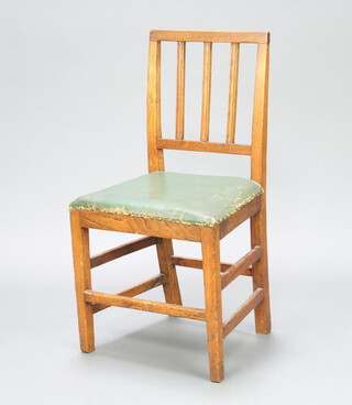 A 19th Century oak stick and rail back dining chair with overstuffed seat raised on square tapered supports with X framed stretcher 84cm h x 45cm w x 36cm d  