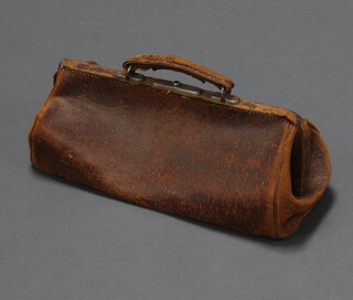 A brown leather Gladstone bag 16cm x 44cm x 18cm (some loss to leather in places) 