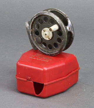 A KP Morritts 3 1/2" centre pin fly fishing reel in a red box