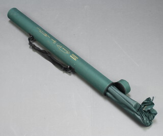 A Shakespeare Triton XT 10' carbon fibre fishing rod in a green cloth tube 