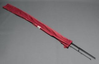 An Abu Garcia Enticer 100-2M fishing rod in red cloth bag 