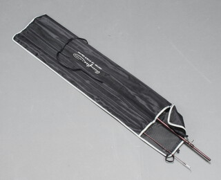 A Abu Garcia Accuflex 10' 5 section fishing rod in a black cloth bag