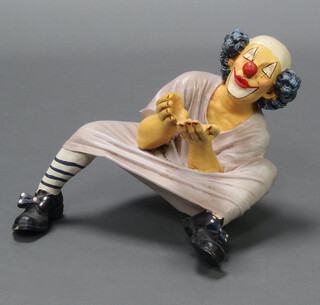 A resin figure of a seated clown 50cm x 32cm x 31cm 