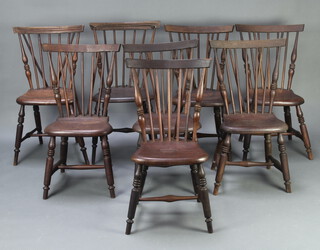 An interesting set of 8 American turned elm stick and rail back Windsor style dining chairs with shaped seats, raised on turned supports with H framed stretchers (1 with leg f, some damaged and repaired, all frames are loose) 89cm h x 51cm w x 37cm d 