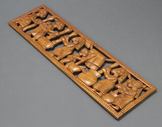 A carved and pierced Nigerian hardwood plaque decorated figures 30cm x 107cm 
