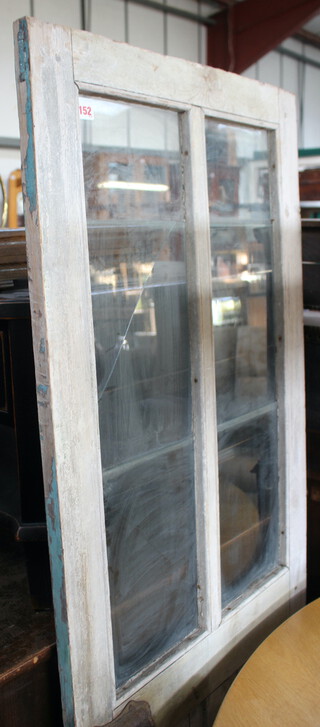 A 19th Century painted interior door 35cm h x 65cm w (1 panel cracked) 