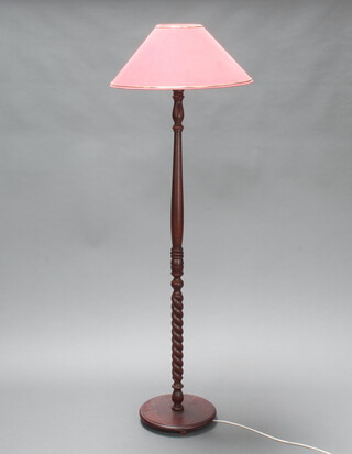 A turned beech standard lamp on a circular base 129cm h x 30cm 