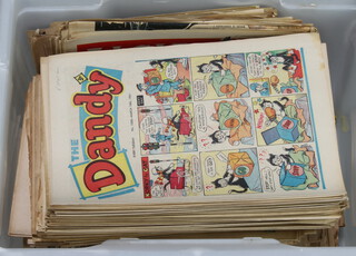 A plastic box containing various 1960's editions of The Dandy, The Beano and The Eagle 