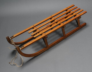 Davos, a beech and steel toboggan 25cm h x 124cm l x 28cm w 