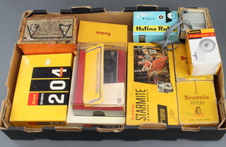 Two Kodak 204 Instamatic cameras boxed, a Duo Ensign box camera boxed, a Brownie Starmite camera outfit boxed, a Brownie 127 camera boxed, 2 Brownie Rolleiflex cameras boxed, a Halina Rolls camera boxed, a Kodak Instamatic 77-XC camera boxed, a Brownie Vecta camera boxed, a Brownie flash holder no.5 boxed 