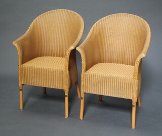 A pair of light coloured Lloyd Loom tub back chairs 89cm h x 60cm w x 47cm d (seat 27cm x 34cm) 