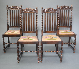 A set of 4 1930's oak stick and bar back dining chairs with Berlin woolwork drop in seats, raised on turned and block supports with spiral turned columns to the sides 107cm h x 46cm w x 40cm d (frames loose)