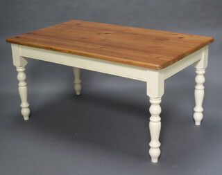 A rectangular pine and white painted kitchen table, raised on turned supports 77cm h x 152cm l x 91cm w (contact marks)  