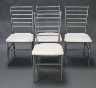 A set of 4 grey painted tubular metal ladder back dining chairs, seats upholstered in white fabric 90cm h x 41cm w x 40cm d (seat 27cm x 28cm, marks to the seats) 
