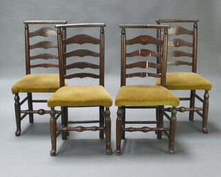 A set of 4 19th Century elm ladder back dining chairs with upholstered seats, raised on club supports 97cm h x 50cm w x 38cm (There are signs of old but treated worm in places, in barn condition)  