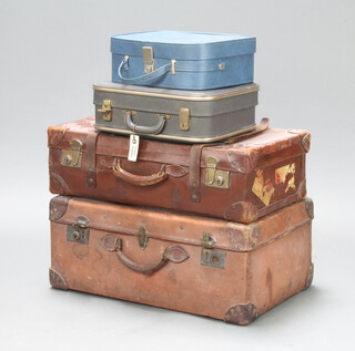 A leather suitcase with brass mounts 20cm x 67cm x 38cm, a fibre ditto 28cm x 65cm x 42cm together with a 1960's grey suitcase 12cm x 40cm x 35cm, a lady's 1960's blue vanity case 12cm x 35cm x 34cm  