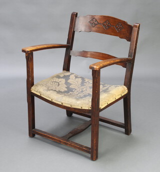 A 1930's oak ladder back open armchair with upholstered seat raised on square supports 73cm h x 56cm w x 45cm d (30cm x 23cm) 