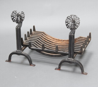 A pair of 19th Century wrought iron fire dogs decorated stags and thistles 57cm h x 47cm x 31cm together with a fire basket (1 a/f) 