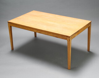 A mid-Century rectangular teak coffee table raised on square tapered supports 54cm h x 120cm w x 70cm d 