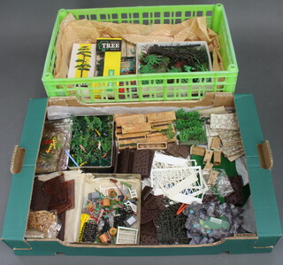 A collection of Britains plastic "Floral Garden" contained in a fruit box together with a collection of Britains farm accessories, trees etc in a green box  
