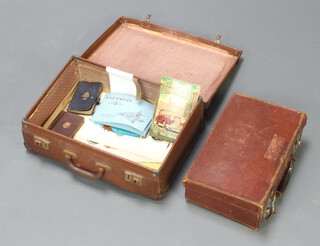 A fibre suitcase 14cm x 44cm x 31cm containing leather attache case 10cm x 35cm x 23cm and a small collection of ephemera 
