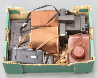 Two box cameras, an Agfa folding camera, a Kodak vest pocket camera Model B and other cameras contained in a small fruit box 