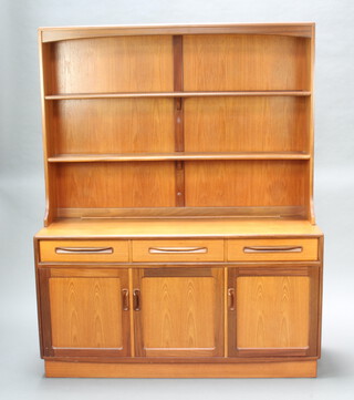 G-Plan, a teak dresser, the raised back fitted 2 shelves, the base with 3 long drawers above triple cupboard with countersunk handles 176cm h x 141cm w x 44cm d 