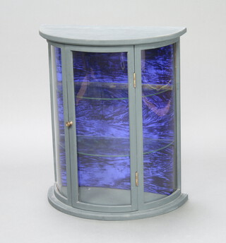 A grey painted bow front hanging display cabinet with  2 glass shelves, 60cm h x 51cm w x 25cm d 