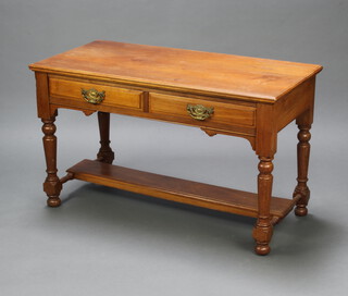 An Edwardian walnut dressing/side table fitted 2 drawers and with undertier 66cm h x 113cm w x 52cm 