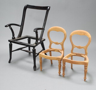 A pair of childrens reproduction Victorian mahogany balloon back dining chairs on turned and fluted supports 65cm h x 27cm w x 35cm d (both require polish and upholstery) together with a Victorian ebonised open arm chair on turned supports 90cm h x 60cm w x 42cm d (requires upholstery)  
