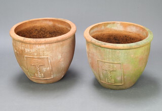 A pair of well weathered circular terracotta plant pots with tree decoration 42cm h x 53cm diam.  