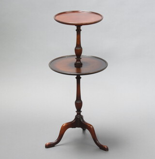 A Georgian style circular 2 tier dumb waiter, raised on a turned column and tripod base 85cm h x 30cm diam. (pitting and contact marks) 