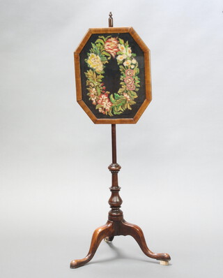 A Victorian pole screen with octagonal wool work banner raised on turned column and tripod base 113cm h x 34cm w (old repair to foot, blocks to 2 of the feet to make it stand true) 