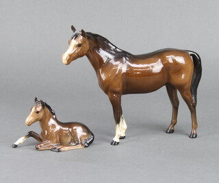 A Beswick figure of a standing race horse 20cm, a ditto of a reclining foal 8cm 